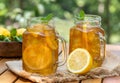 Ice tea in glass jars with lemon and mint Royalty Free Stock Photo