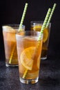 Ice tea with lemon. Black stone background Royalty Free Stock Photo