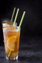 Ice tea with lemon. Black stone background Royalty Free Stock Photo