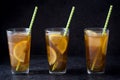 Ice tea with lemon. Black stone background Royalty Free Stock Photo