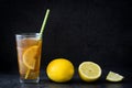 Ice tea with lemon. Black stone background Royalty Free Stock Photo