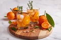 Ice tea with orange juice, ice cubes, and thymes. Refreshing summer beverage. Royalty Free Stock Photo