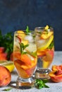 Ice tea with peach and lemon. Cold drink. Royalty Free Stock Photo