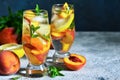 Ice tea with peach and lemon. Cold drink. Royalty Free Stock Photo