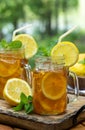 Ice tea in two glass jars with lemon and mint Royalty Free Stock Photo