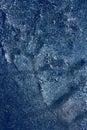 Ice texture with frozen bubbles and cracks on a dark blue background. Beautiful abstract decorative background. Stylish abstract Royalty Free Stock Photo