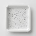 An ice tray and water droplet tray made of white plastic Royalty Free Stock Photo