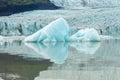 Ice wall and icebergs in Fjallsarlon glacier lagoon, abstract landscape Iceland