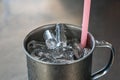 Ice water in a glass of stainless steel Royalty Free Stock Photo