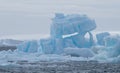 Iceberg in Antarctic Sound with a Glacier in the Background