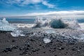 An iceberg being broken by the waves at Jokulsarlon - Iceland