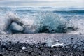 An iceberg being broken by the waves at Jokulsarlon - Iceland