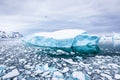 Iceberg with blue ice and covered by snow in Antarctica, scenic frozen landscape in Antarctic Peninsula Royalty Free Stock Photo