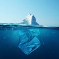 Iceberg with bottle in the ocean underwater. Environmental pollution. Plastic water bottles pollute ocean