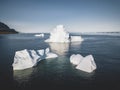 An Iceberg Of Colossal Size In The Form Of A Castle seen from above aerial. Floats In The Cold Waters Of Greenland in Royalty Free Stock Photo