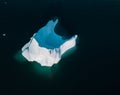 An Iceberg Of Colossal Size In The Form Of A Castle seen from above aerial. Floats In The Cold Waters Of Greenland in Royalty Free Stock Photo