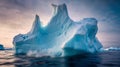 Iceberg floating in the ocean at sunset