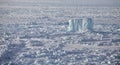 Iceberg in frozen Arctic Ocean