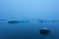 Iceberg in lagoon at midnight. Long exposure