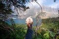 Iceberg Lake trail in Glacier National Park Montana - hiker`s hand holds a large cinnamon roll