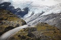 Iceberg with mountain road and a car Royalty Free Stock Photo