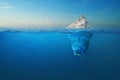 Iceberg - plastic bag with a view under the water. Pollution of the oceans. Plastic bag environment pollution with iceberg. The Royalty Free Stock Photo