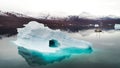 Iceberg with sailing boat in Greenland