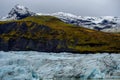 Iceberg with snow mountain background