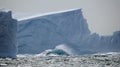 Iceberg in stormy seas Royalty Free Stock Photo