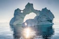Iceberg during sunrise with backlight by sunrays.