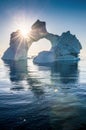 Iceberg during sunrise with backlight by sunrays.