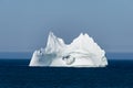 Iceberg with a Wave Crashing Through Large Hole, Newfoundland Royalty Free Stock Photo
