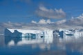 Icebergs in Antarctica, huge table iceberg, tabular iceberg with gate and reflections