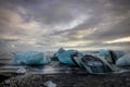 Icebergs floating in Jokulsarlon glacier lake at sunset in Icela