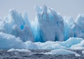 Icebergs with Holes and Spikes in Bright Blue Royalty Free Stock Photo