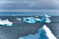 Icebergs in iceberg graveyard in Fjord, Greenland. Different icebergs broken from glaciers in Greenland. Royalty Free Stock Photo