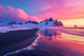 Icebergs on Iceland\'s black sand beach under a colorful sunrise, with snow-capped mountains backdrop
