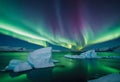 Icebergs under the northern lights v1 Royalty Free Stock Photo