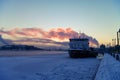 Icebreaker `Capitan Pain` on Big Neva embankment river near Annunciation Blagoveshchensky bridge. Winter sunset Royalty Free Stock Photo