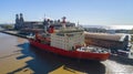 Icebreaker ship in the harbor with the background of the city.