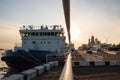 Icebreakers on the background of the sunset. Ice-drift on the Northern Dvina. Mikhailo-Archangel Cathedral