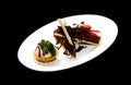 Icecream and cake served with chocolate toping and strawberry