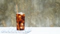 Iced aerated soft drink on a white wooden table