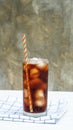 Iced aerated soft drink on a white wooden table
