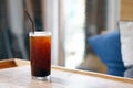 Iced americano - A glass of black coffee on table and copy space, The style of coffee prepared by brewing espresso.