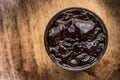 Iced black coffee on wood background