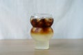 Iced black coffee with yuzu fruit juice.