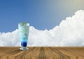 Iced blue italian soda fresh juice on Empty wood table and beautiful blue sky and cloud in background.summer fresh concept.drink