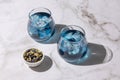 Iced blue tea, two glasses of anchan from butterfly pea flower Royalty Free Stock Photo
