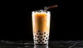 Iced boba tea with tapioca pearls and straw on a dark background Royalty Free Stock Photo
